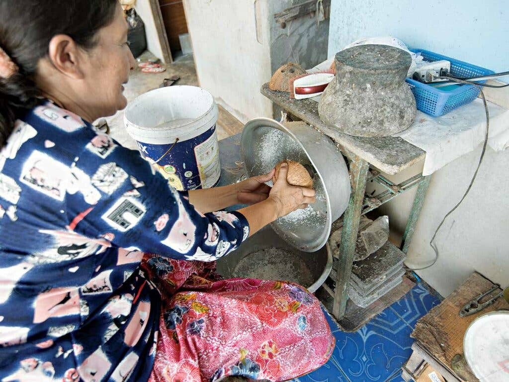 grating coconuts