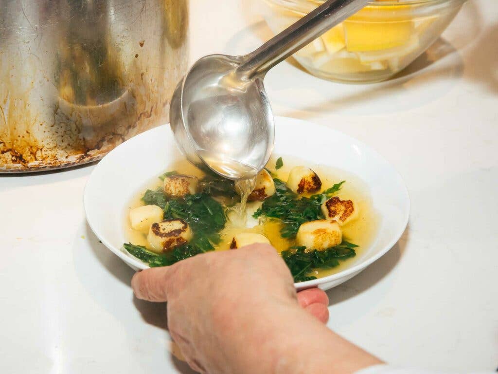 chicken bouillon with bitter greens and Vermont Shepard Verano cheese dumplings