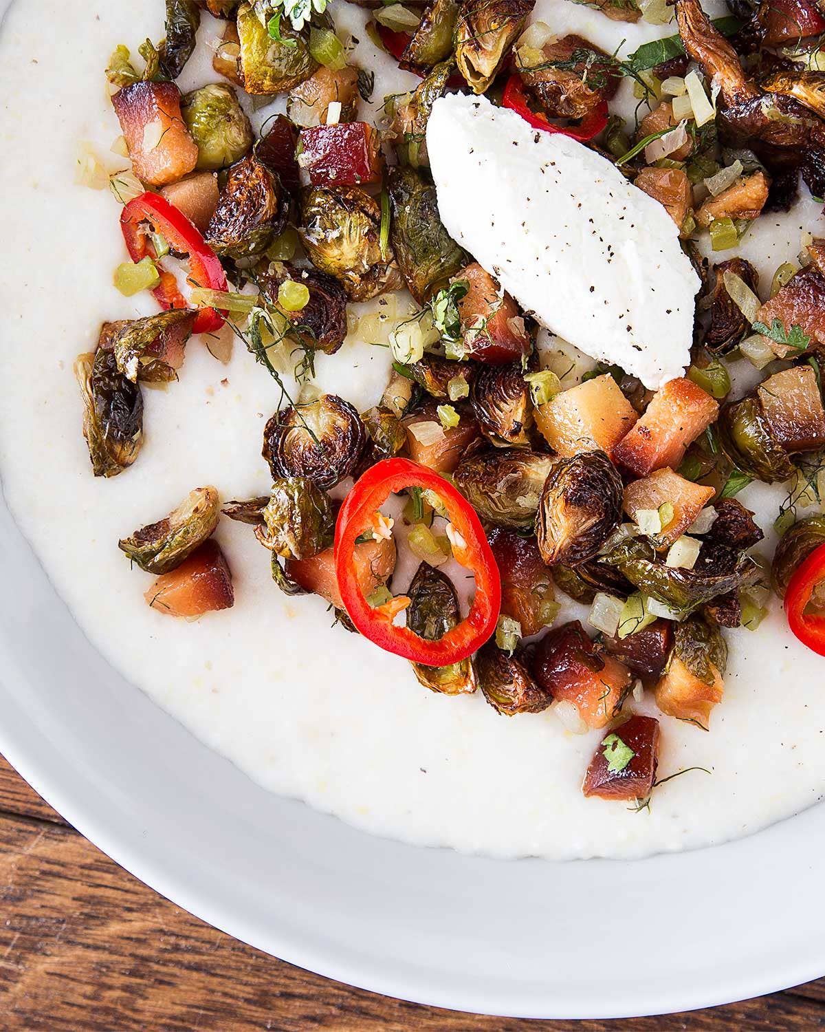 Grits with Brussels Sprouts, Quince, and Goats’ Milk Curd