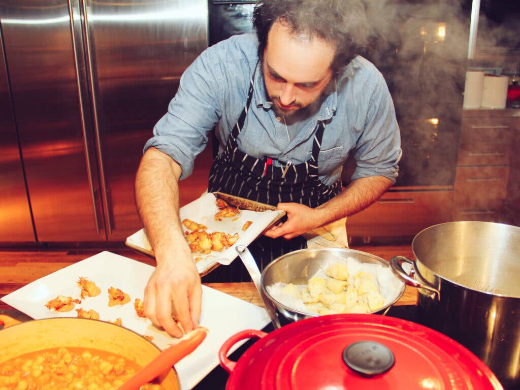 Max Sussman plating crispy artichokes