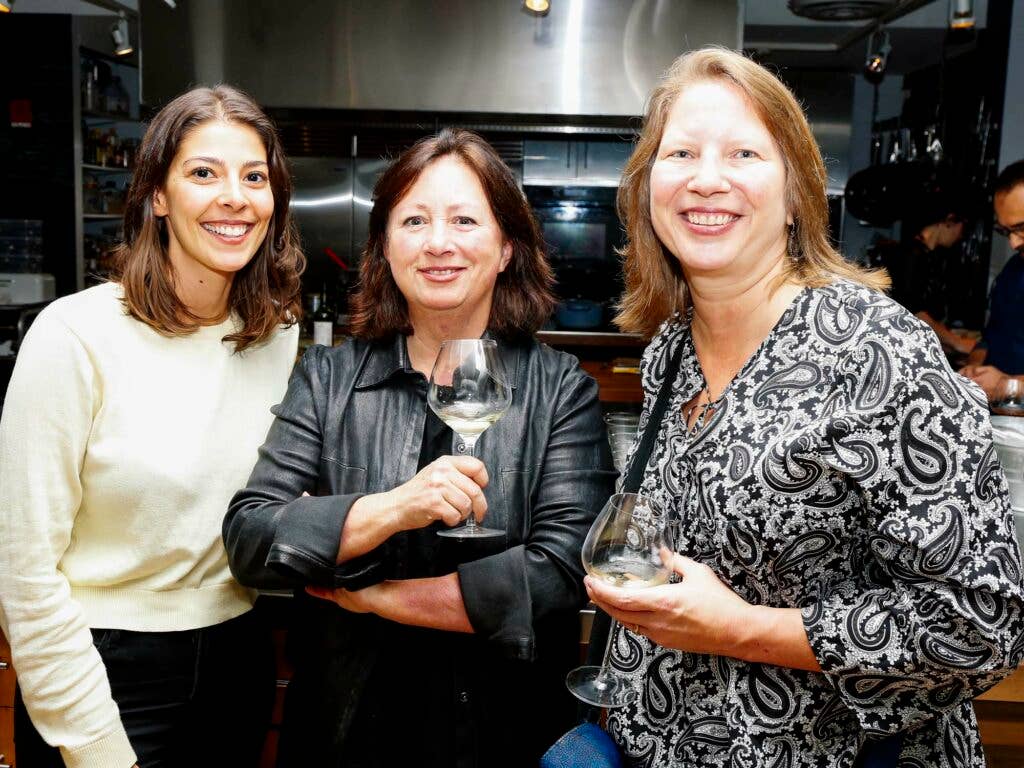 From left, SAVEUR Test Kitchen Director Stacy Adimando, SAVEUR Contributing Editor Shane Mitchell, and writer Kathleen Squires enjoy a drink before dinner.