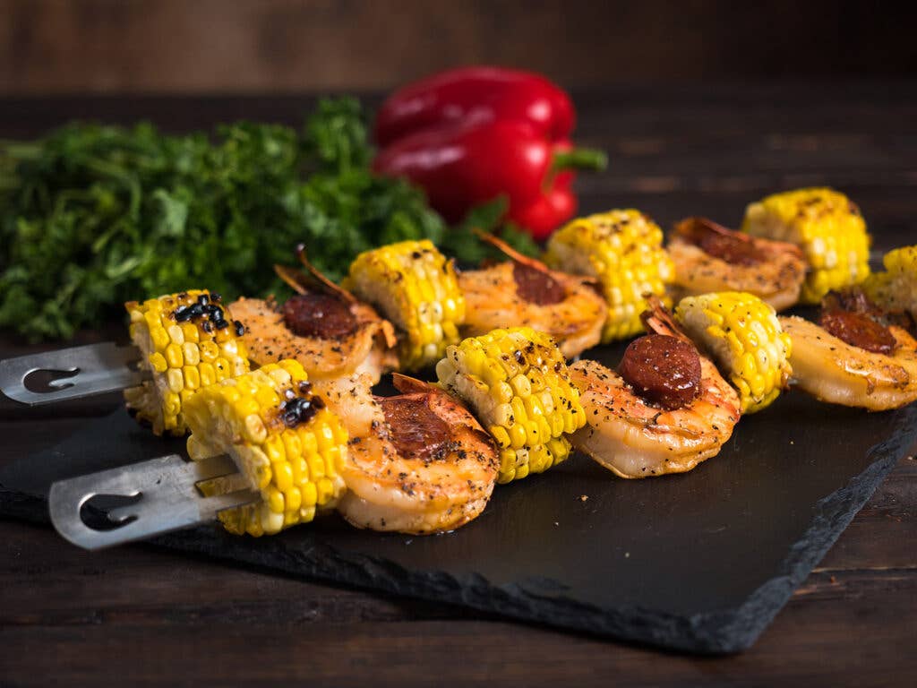 skewers of grilled corn and shrimp