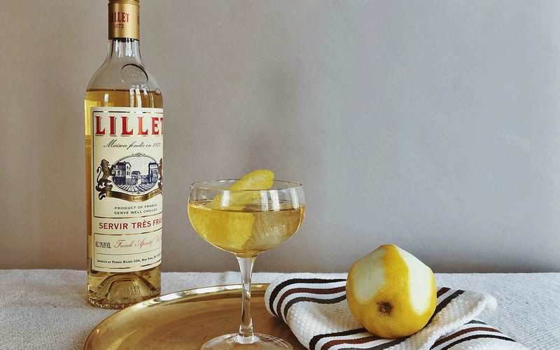 Lillet Vermouth on table with lemon