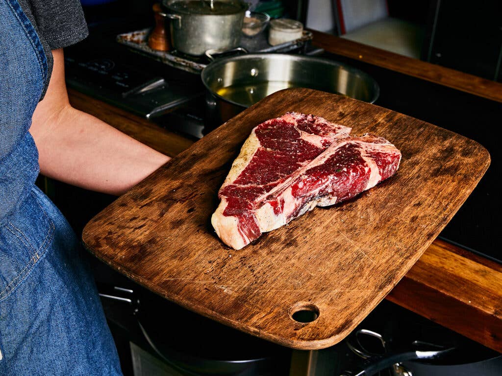 raw steak on cutting board