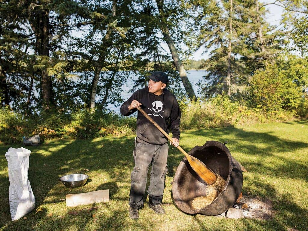 Logan Cloud tends to his cast-iron parching kettle.