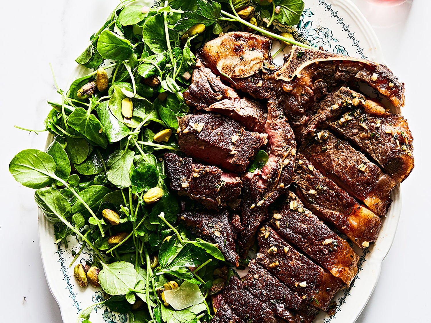 image of Bistecca Alla Fiorentina With Watercress and Pistachio Salad recipe by Saveur