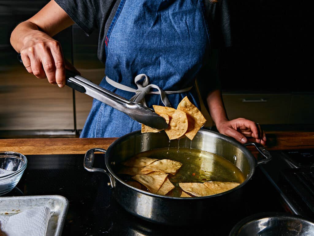 Corn tortilla wedges fried in an inch of oil.