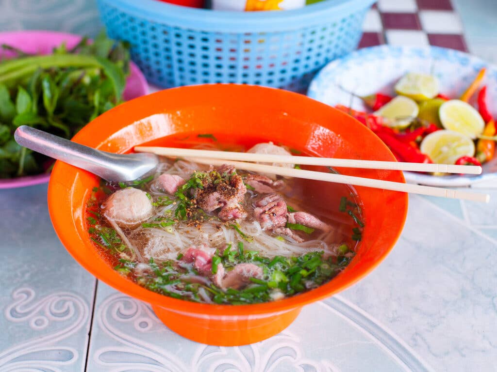 Foe in bowl with chopsticks.