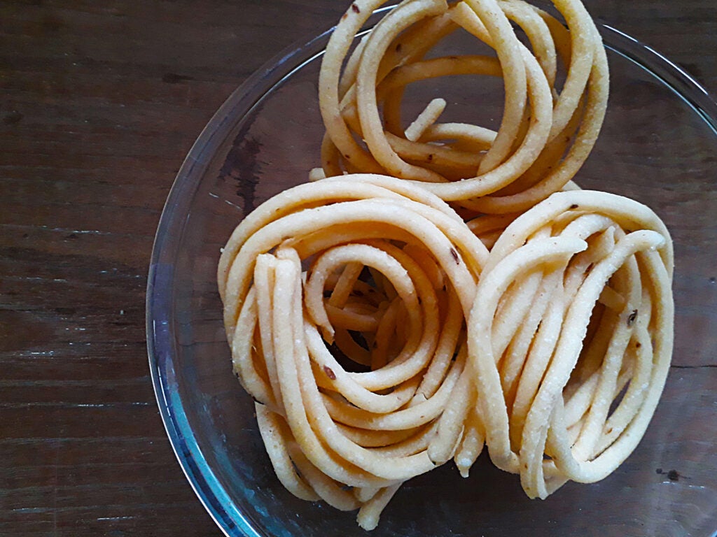 Murukku in bowl.