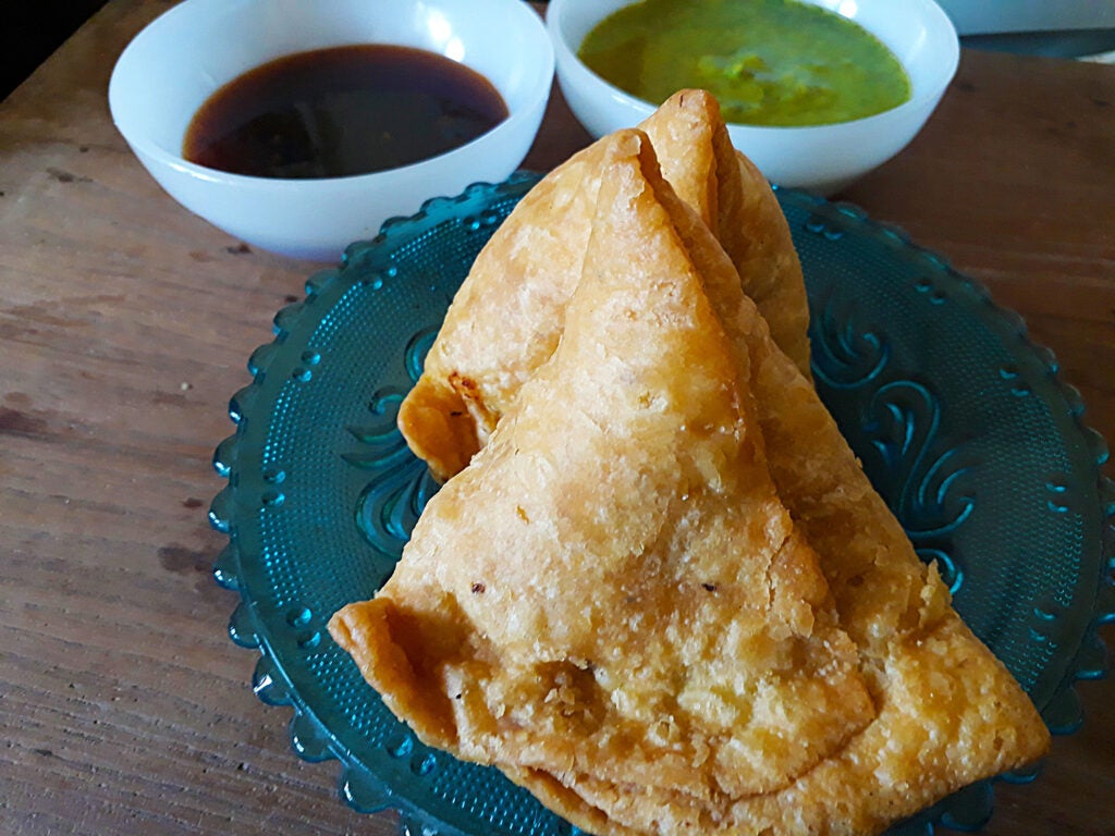 Samosa on blue serving dish