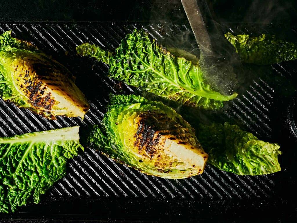 Hot cast-iron grill pan chars cabbage.