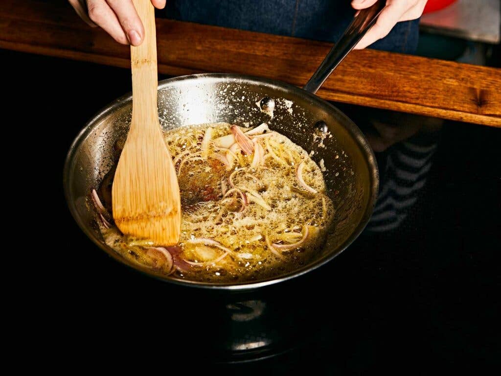 Sweating the shallots and garlic in browned butter.