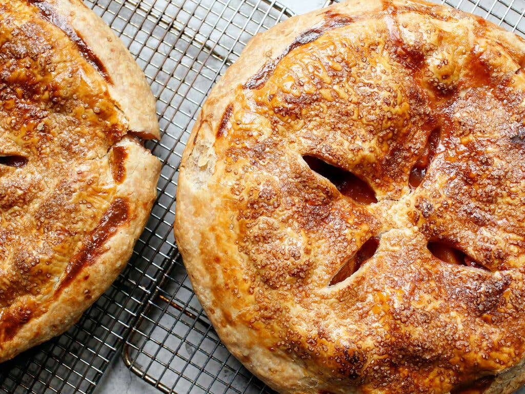 Peach-Raspberry Pie on cooling racks.