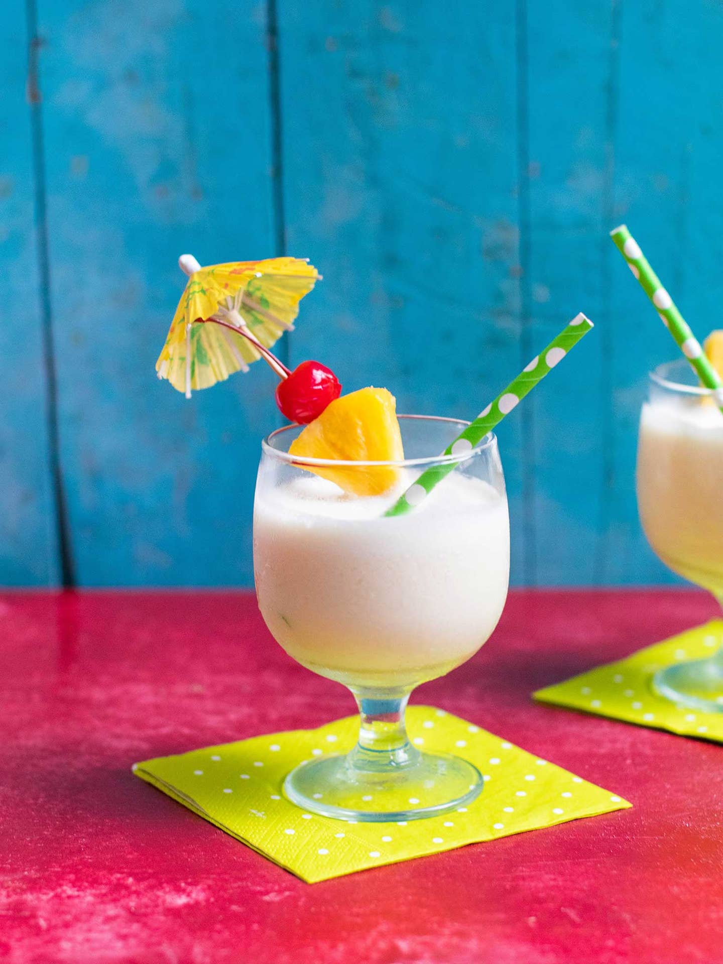 Frozen pina colada with umbrella and cherry on top