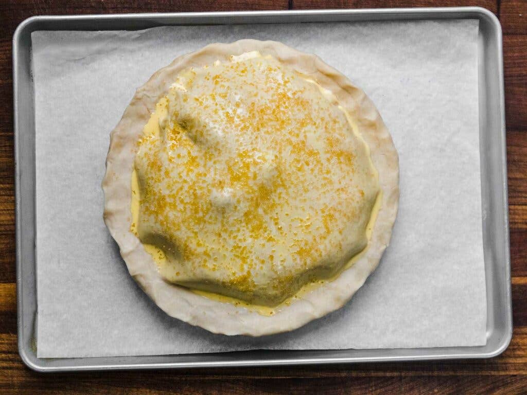 Pie crust with egg wash and a sprinkling of sanding sugar.