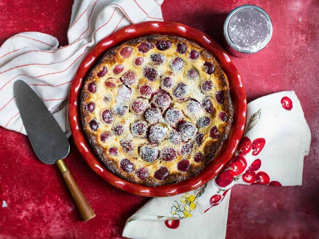 Cherry Clafoutis recipe on red background