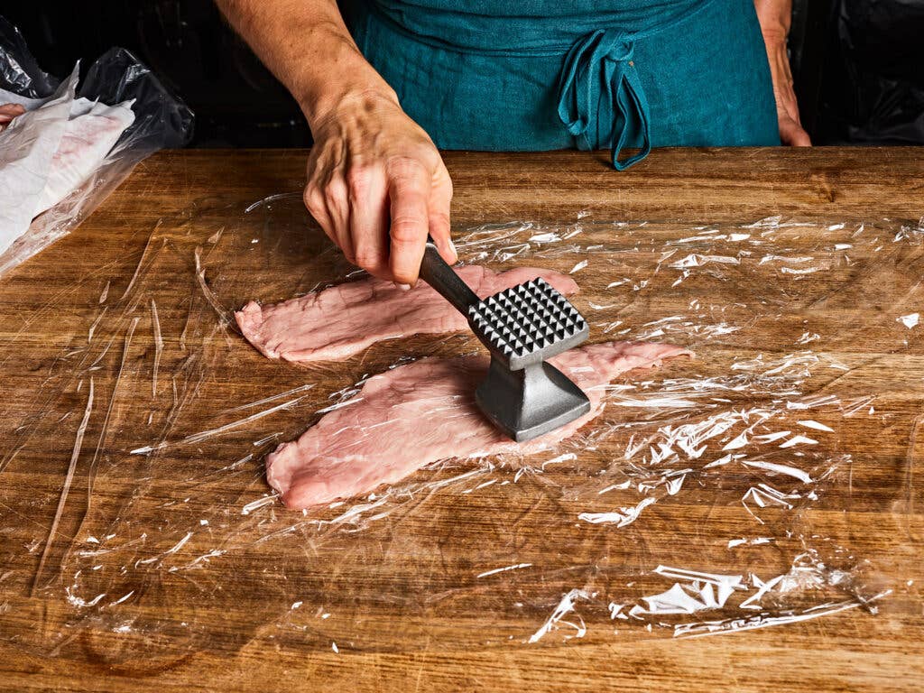 Veal cutlets pounded thin with a meat mallet.