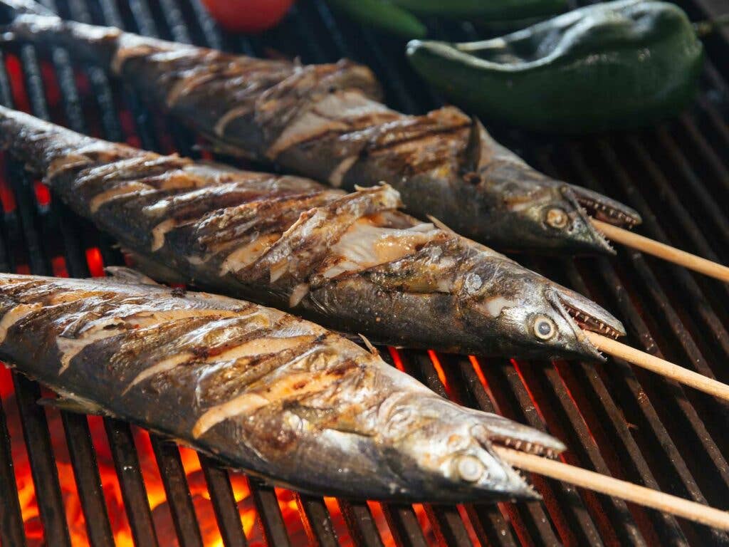 Skewers of fish rubbed with a citrusy achiote-and-tomato-based marinade and grilled.