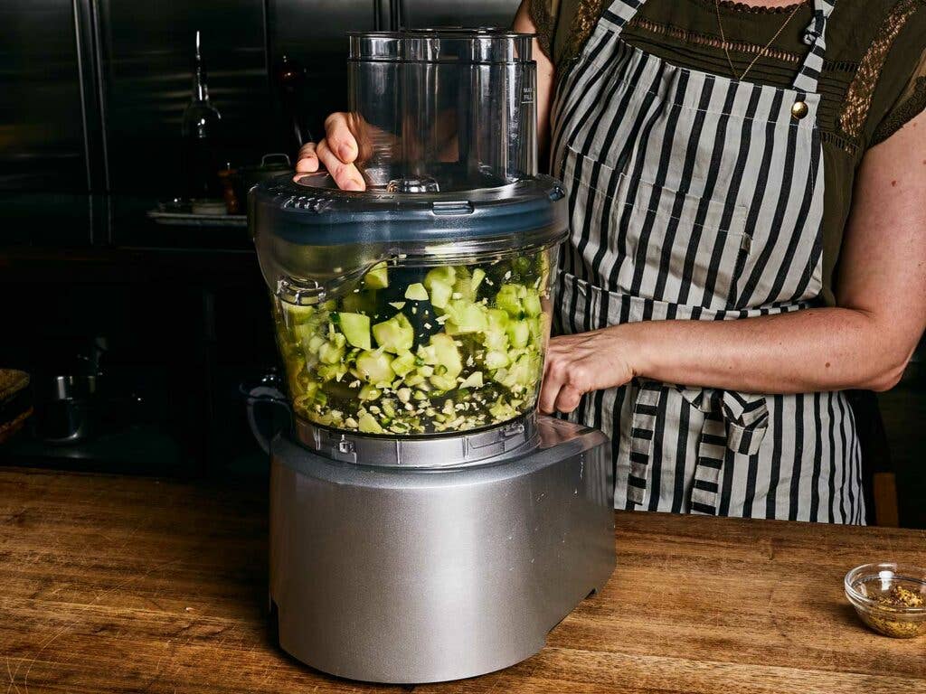 Chopping hearty broccoli stems with food processor.
