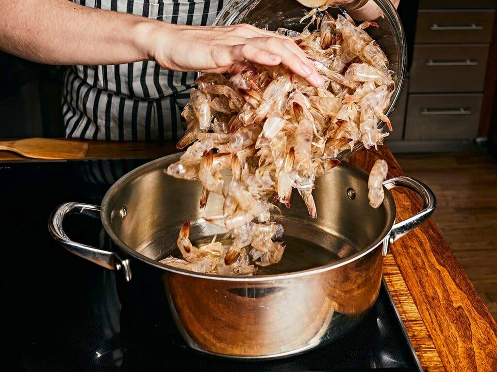 Five cups of shrimp shells poured into pot for base of the stock.