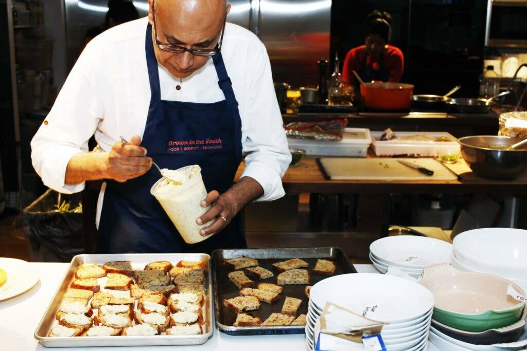 Chef Vishwesh Bhatt preparing Benedictine spread on rye