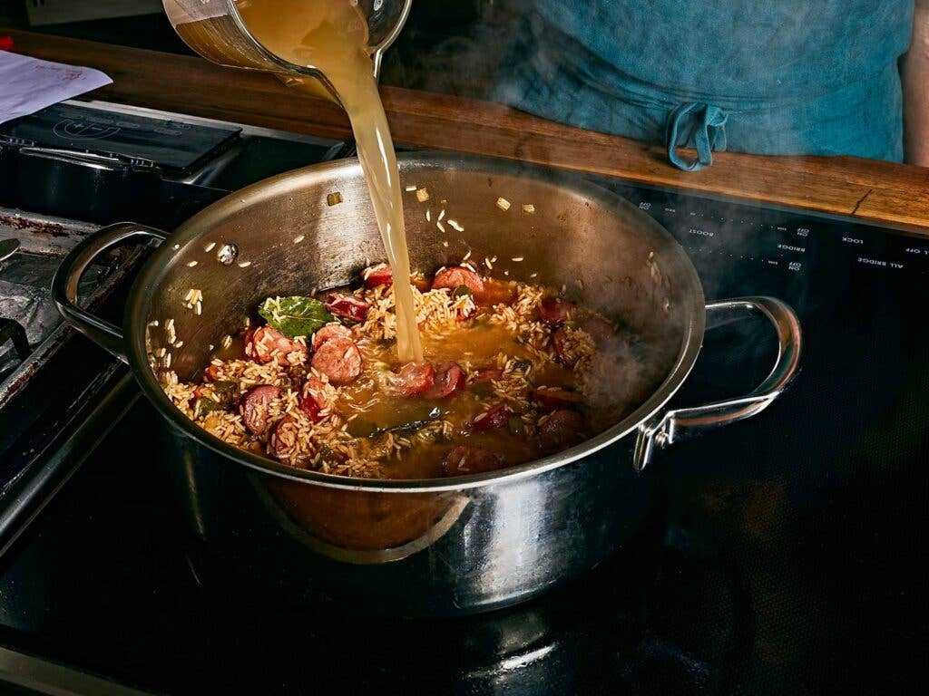 Deglazing the pot with plenty of hot chicken broth.