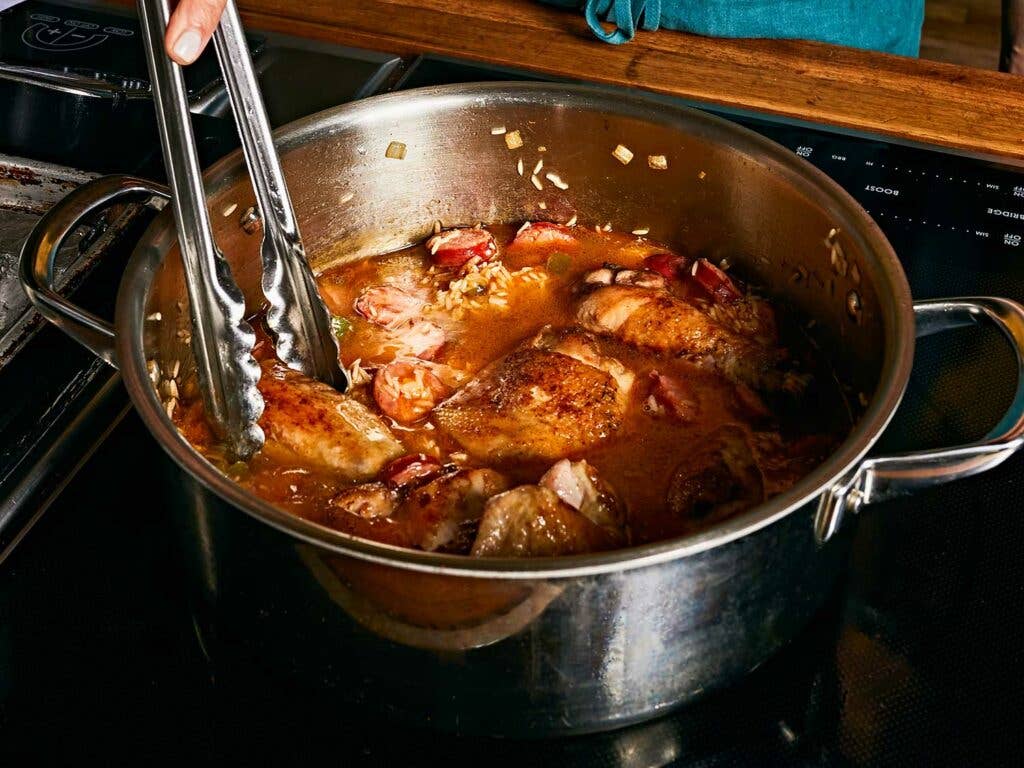 Simmering chicken in pot.