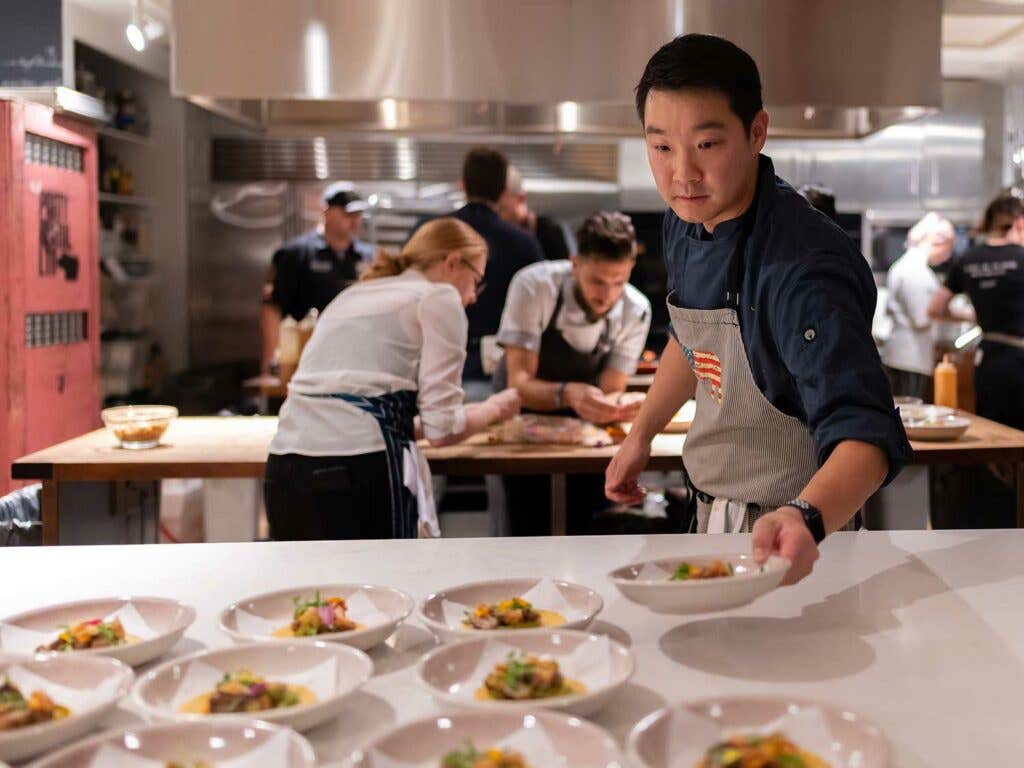 Chef Park plating his lamb belly tacos