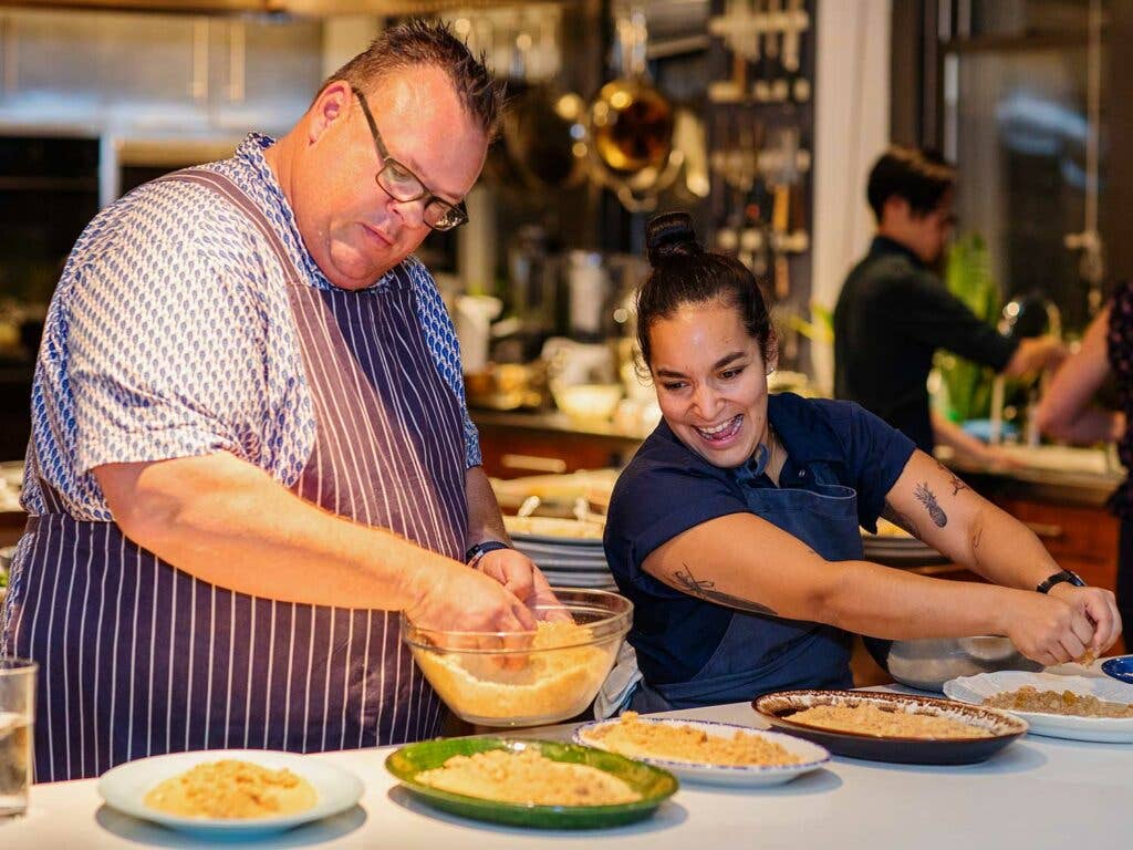 Shepherd and Brito working on dessert.