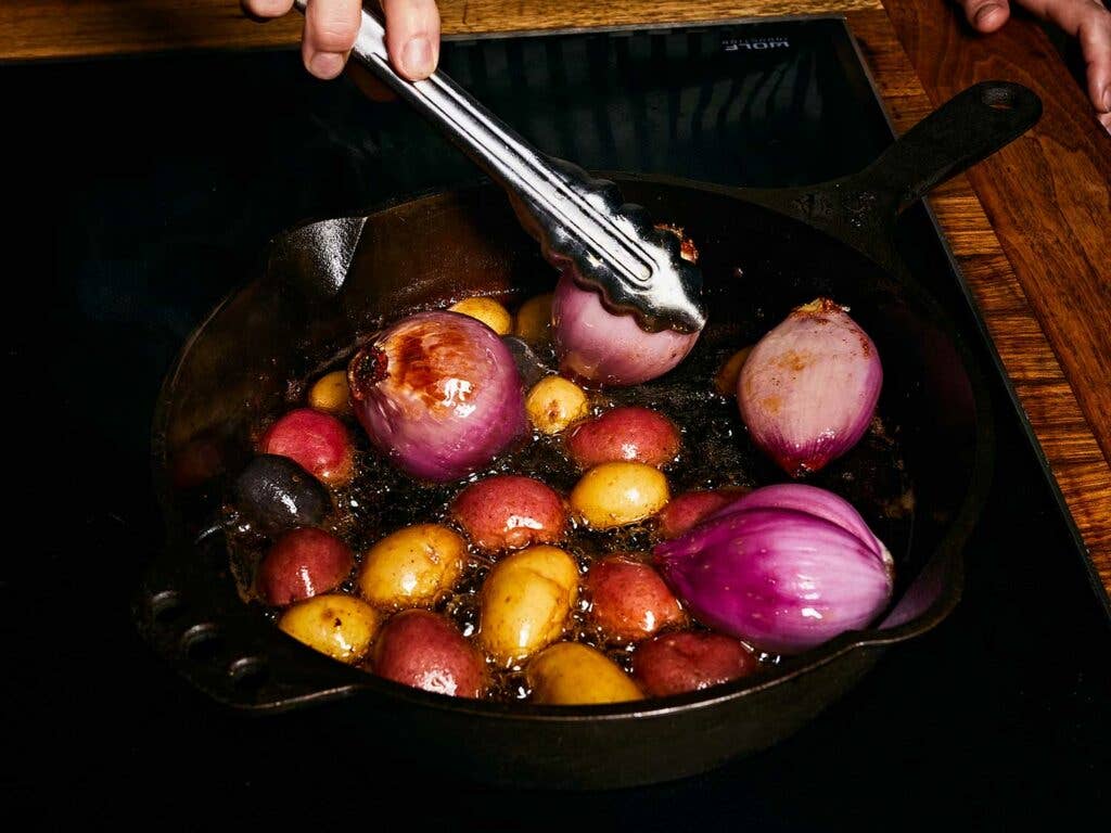 Browning potatoes and shallots to add more flavor to the finished stew.