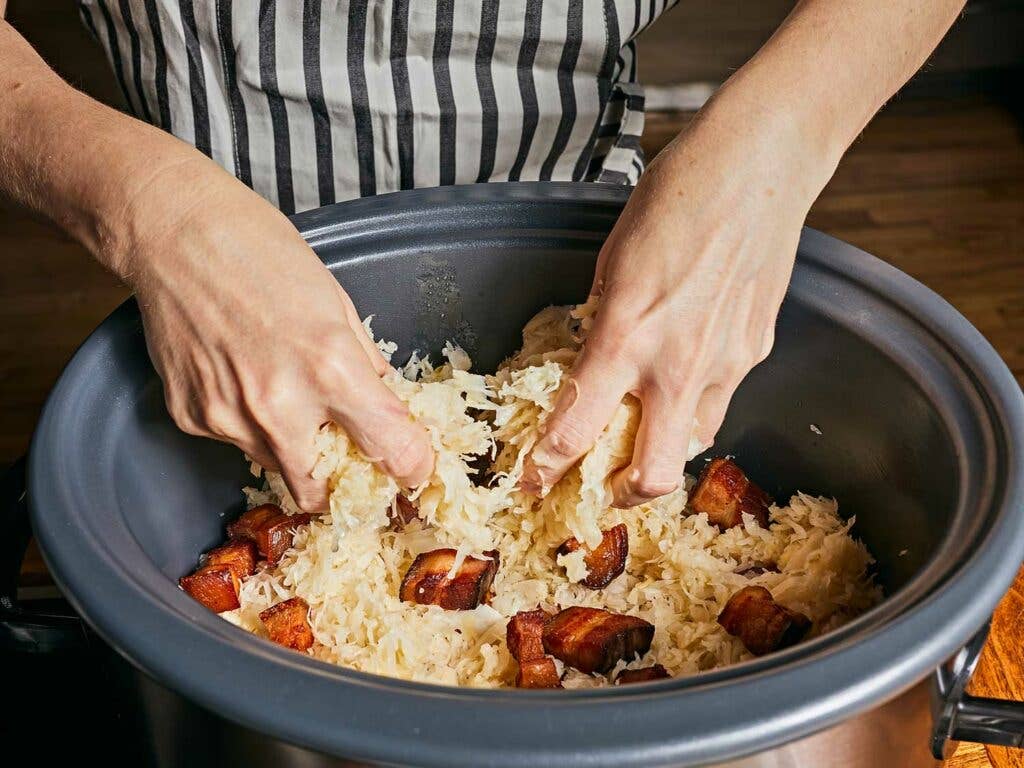 Crispy bacon and tangy sauerkraut layered in the slow cooker.