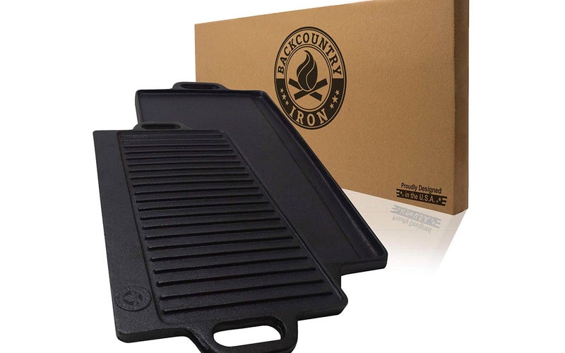 Cast iron grill on one side and a griddle on the other