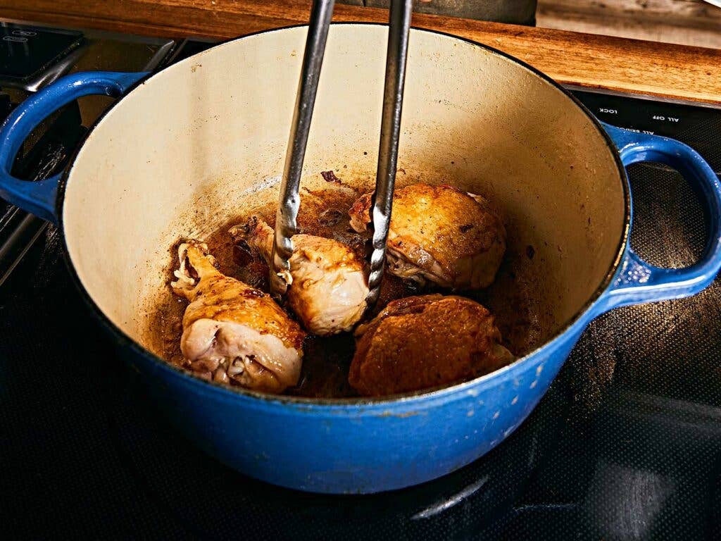 Browning the chicken in the bacon fat left in the pot.