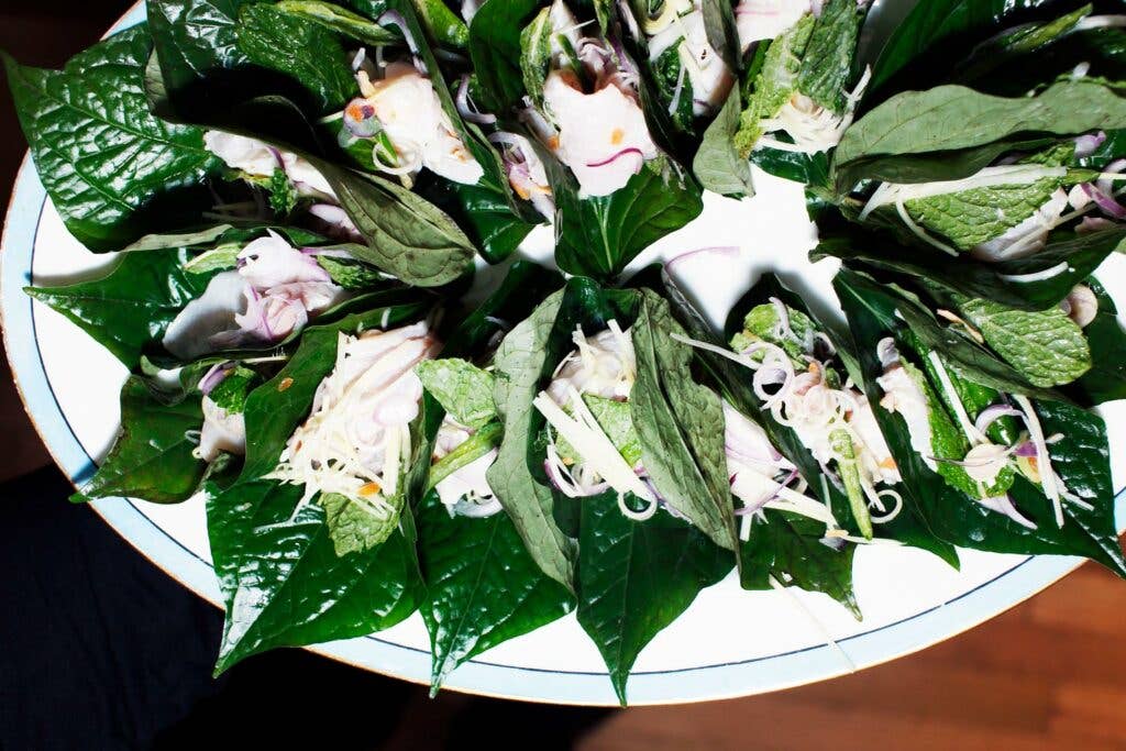 cured kingfish wrapped in betel leaves