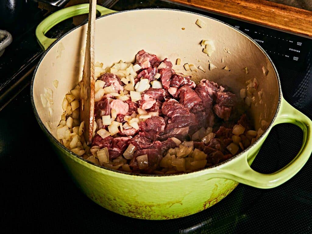 Sauté the onions, then turn up the heat and give your beef a nice sear.