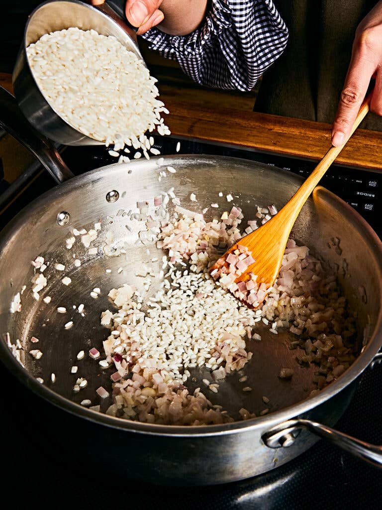Toasting rice in pot.