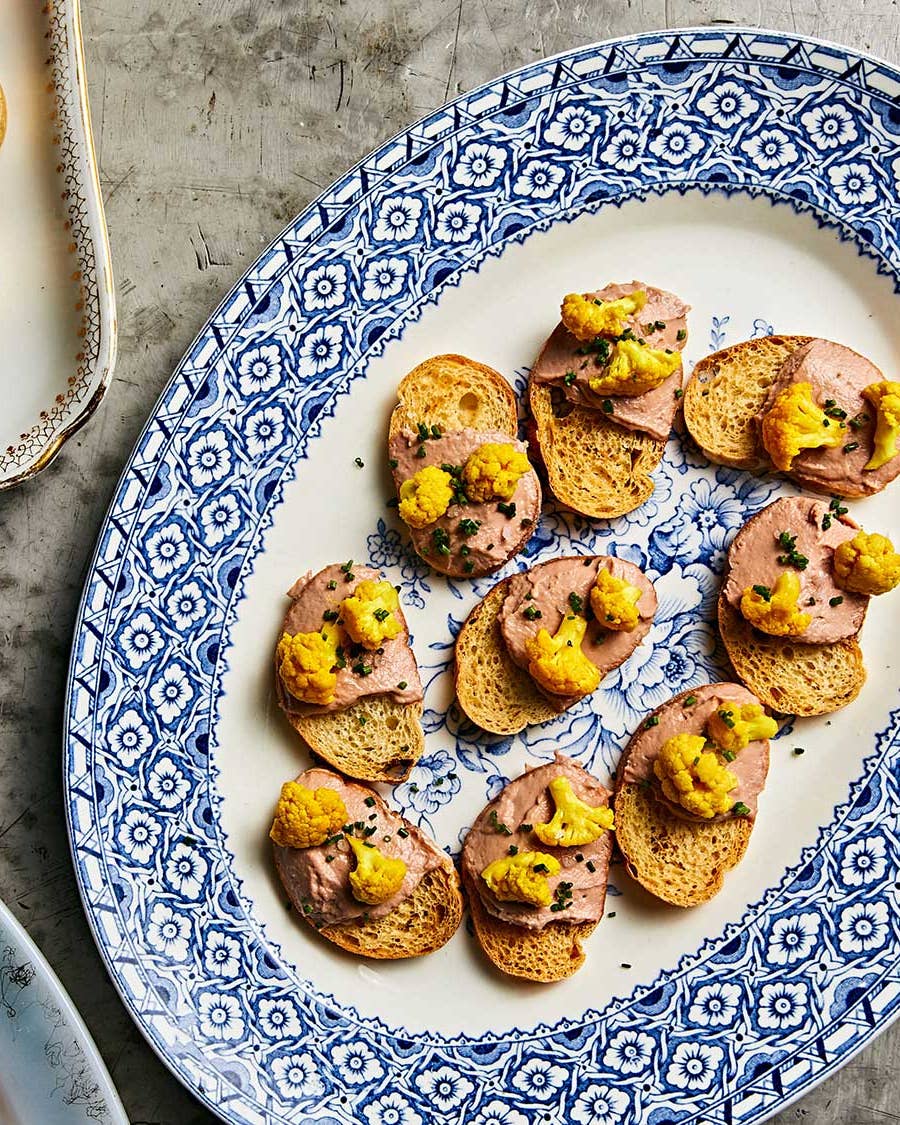 Duck liver mousse crostini with pickled cauliflower.