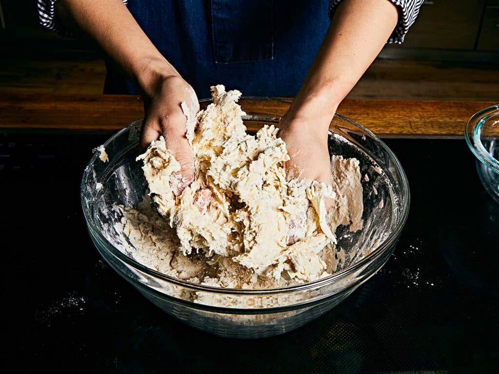 Kneading dough in bowl.