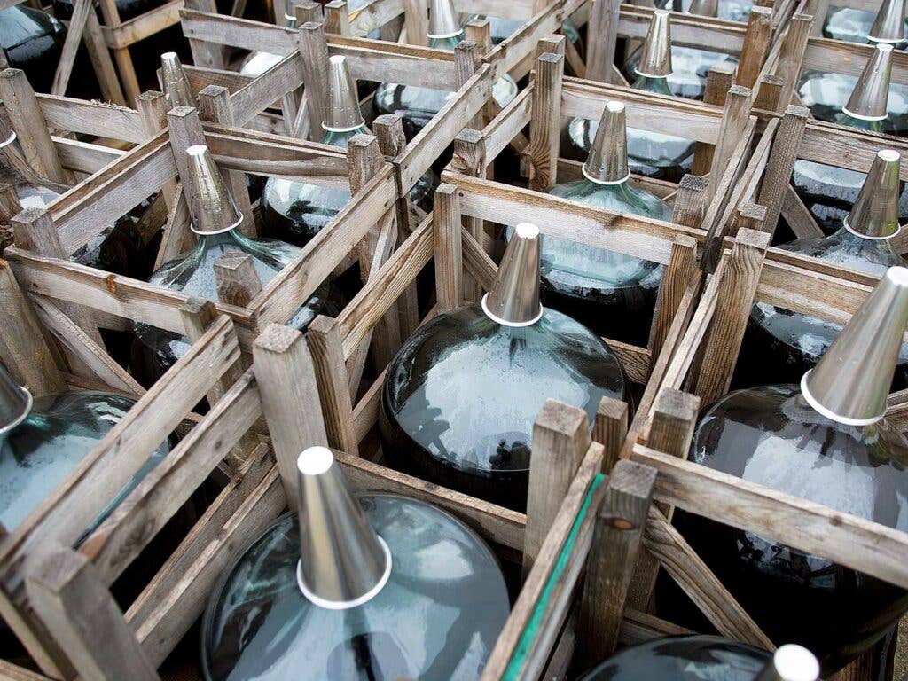 Wine aged outside in glass carboys.