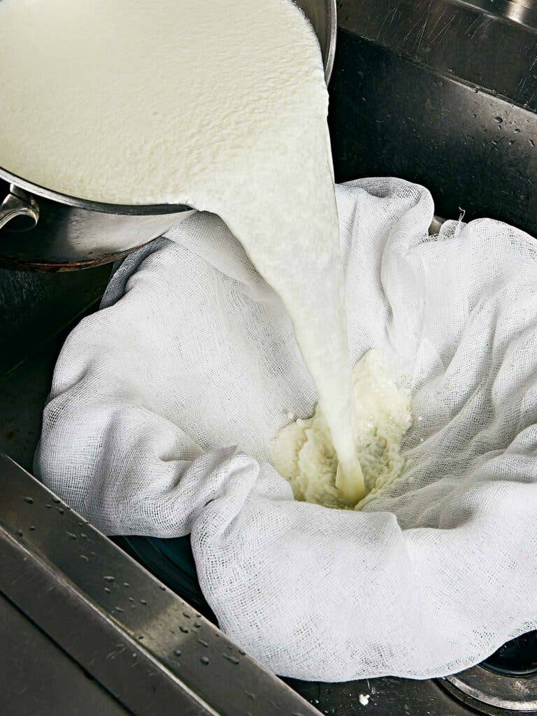 A cheesecloth is essential for draining the cheese properly.