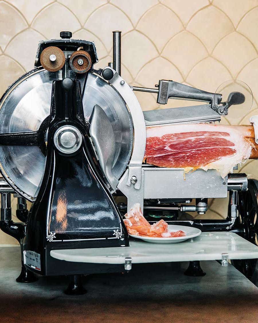 If Money Were No Object, Our Test Kitchen Director Would Buy This Meat Slicer Classic Berkel meat slicer sits behind the bar at Manhattan restaurant Buvette.