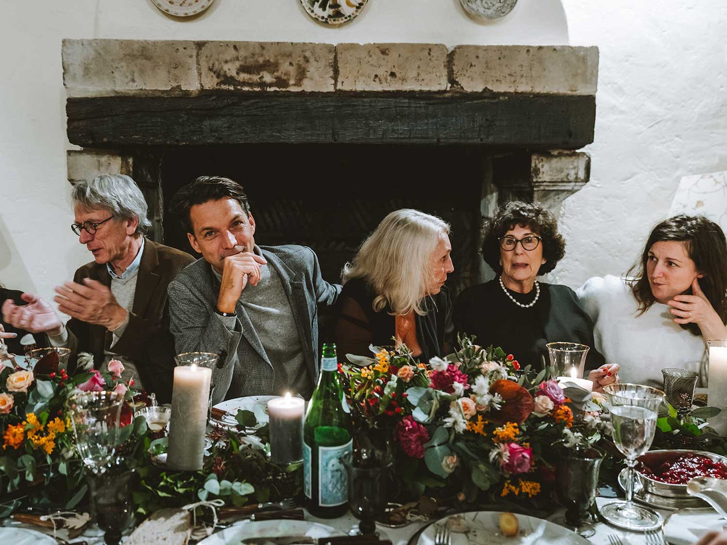 Guests sitting at table at holiday meal.