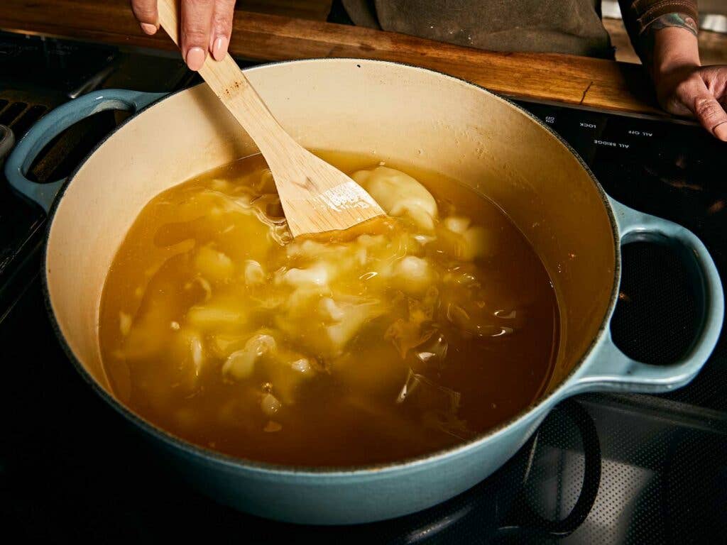 Confit turkey in pot.