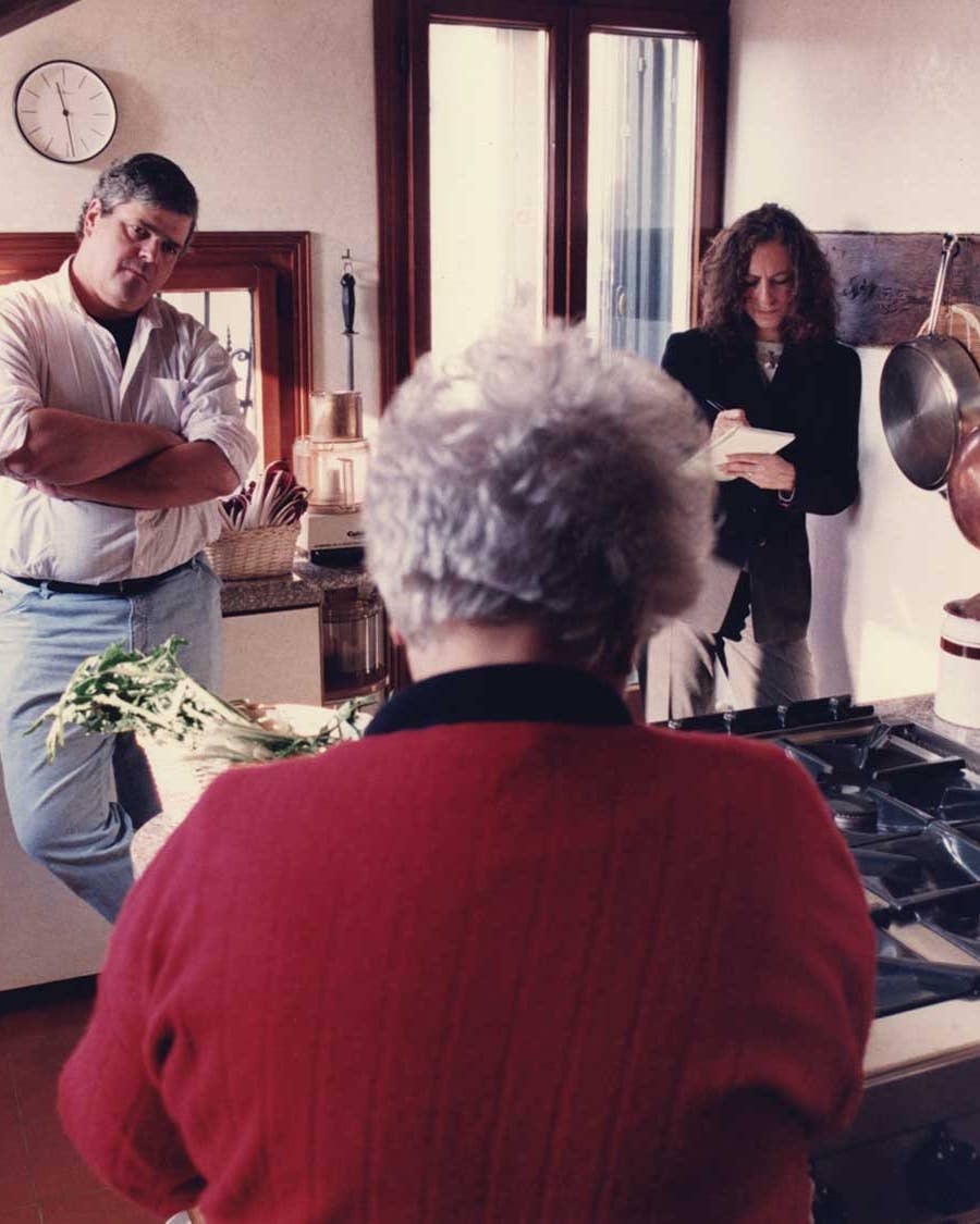 Saveur’s first editor-in-chief, ­Dorothy Kalins (right), and executive editor, Colman Andrews, in the Venice, Italy, kitchen of the late Marcella Hazan, whose back is toward the camera.