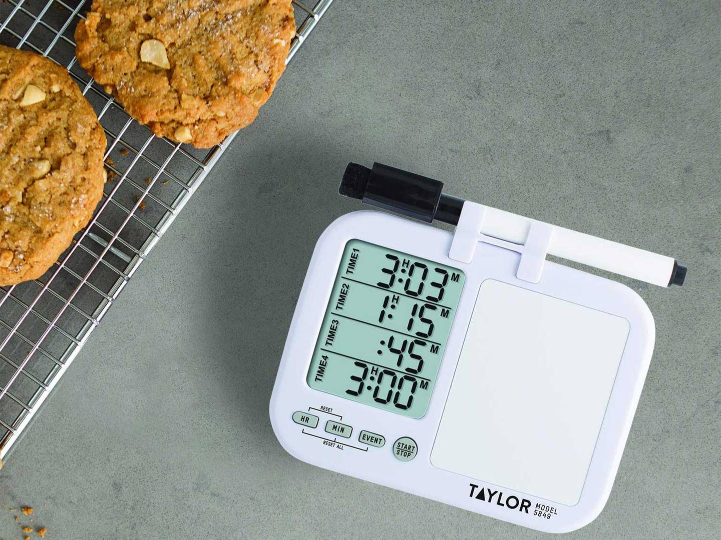 Kitchen timer and cookies on cooling rack.