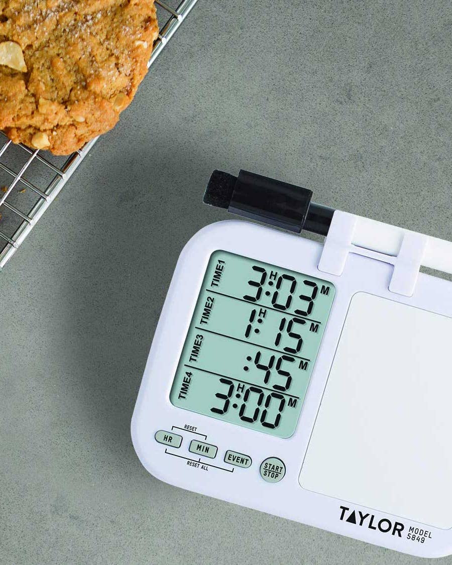Kitchen timer and cookies on cooling rack.