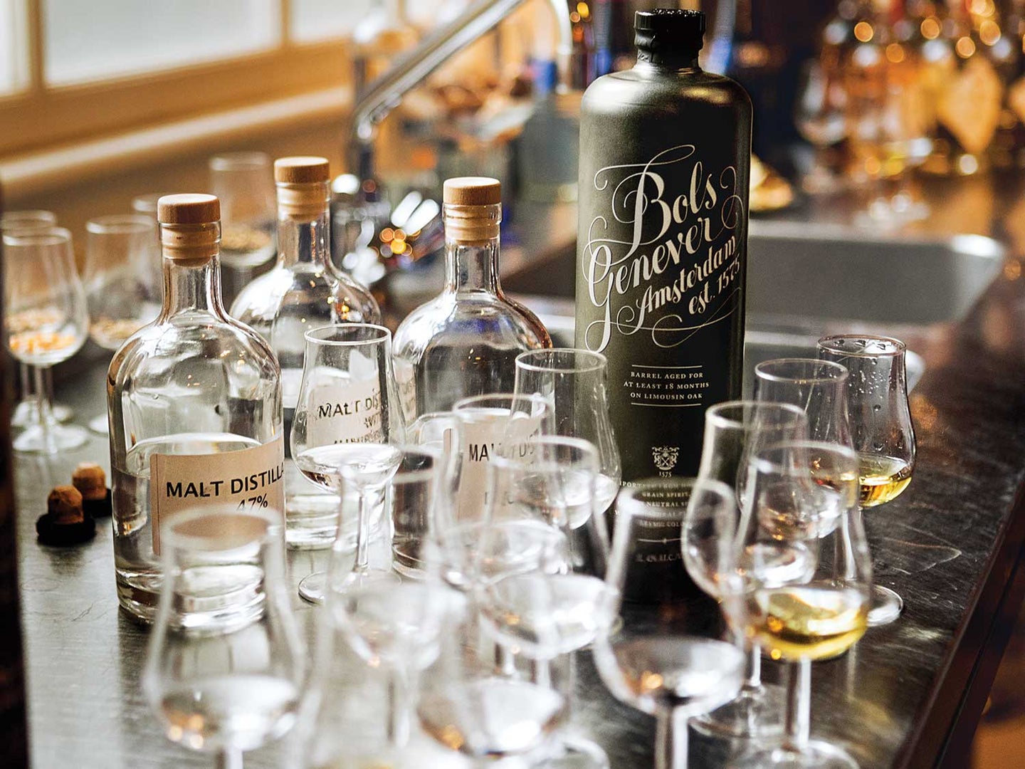 A bottle of Bols genever sits amid base spirits at the 355-year-old Amsterdam distillery.