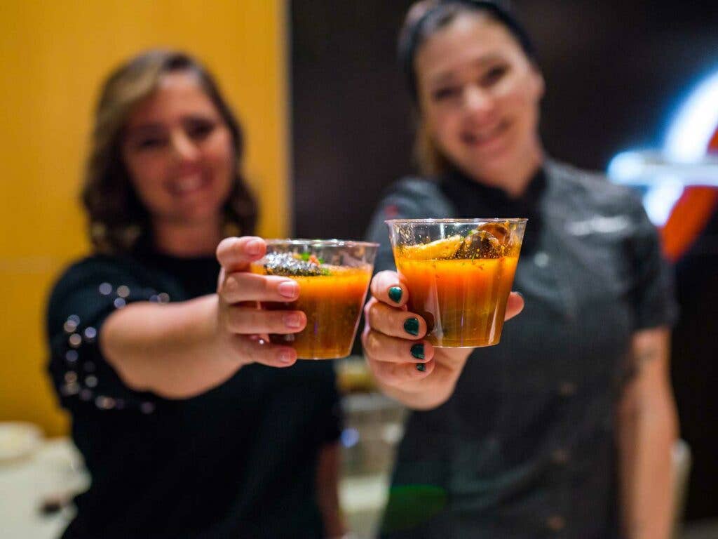 Chef Kayla Robinson (right) of Arnold’s Bar and Grill, the oldest continuously-operating tavern in Cincinnati, serves up satisfying bar food (think fried pretzels with pimento cheese, and the joint’s signature Greek spaghetti topped with garlic sauce, bacon, and olives) alongside more elevated fare, such as the cioppino shown here.