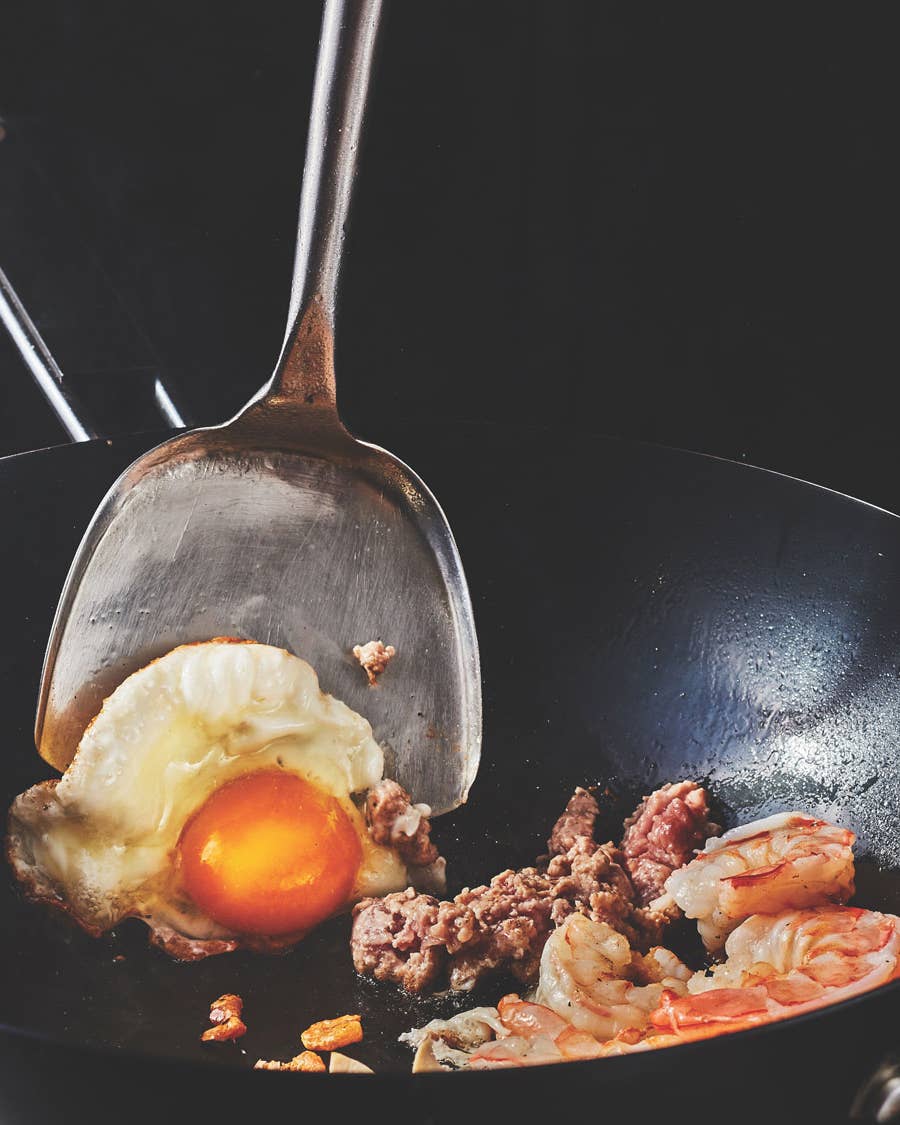 A smoking-hot wok makes for a bubbled and crispy egg.