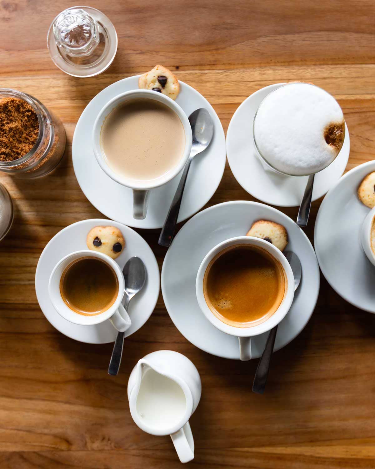Cups of coffee on a wooden table